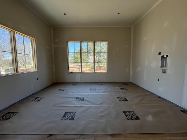 spare room featuring ornamental molding