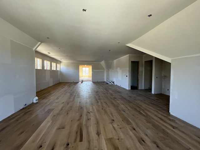 unfurnished living room with wood finished floors