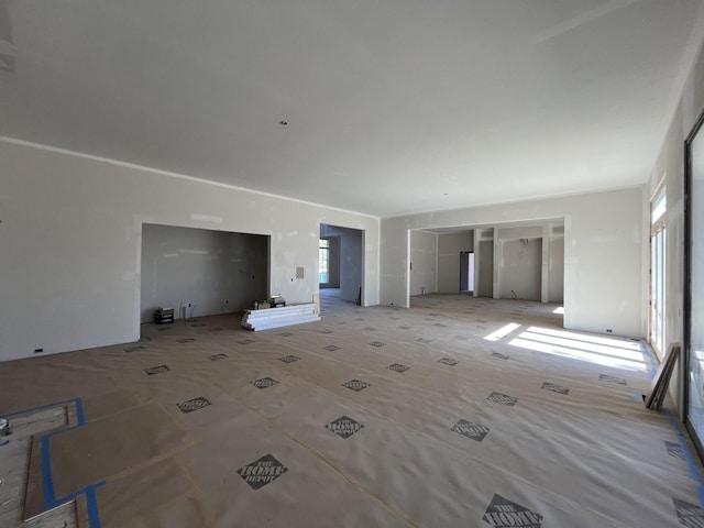 unfurnished living room with a healthy amount of sunlight