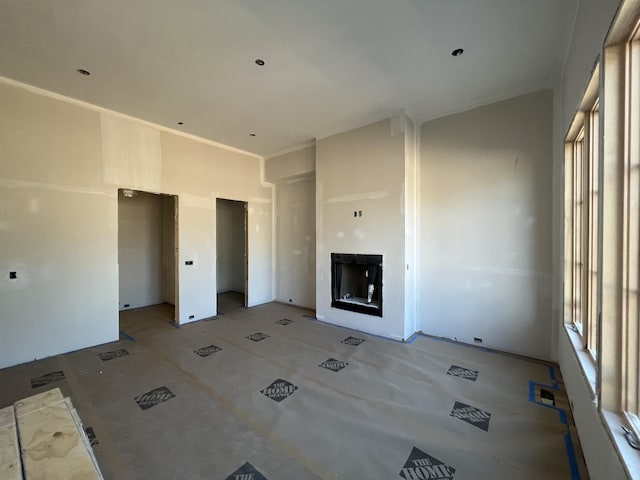 unfurnished living room with a fireplace