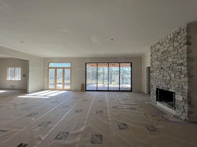 unfurnished living room featuring a fireplace