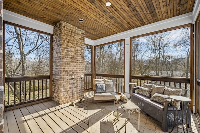 sunroom / solarium featuring wood ceiling