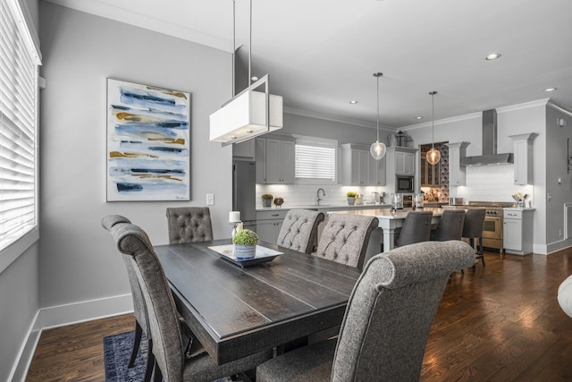 dining space featuring plenty of natural light, dark hardwood / wood-style floors, and sink