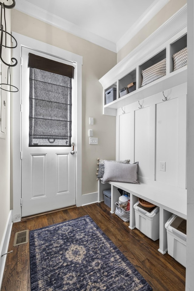 mudroom with ornamental molding and dark hardwood / wood-style floors