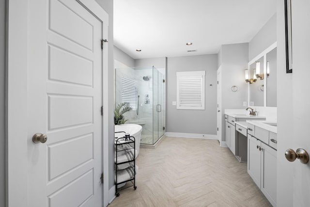 bathroom featuring parquet flooring, vanity, and independent shower and bath