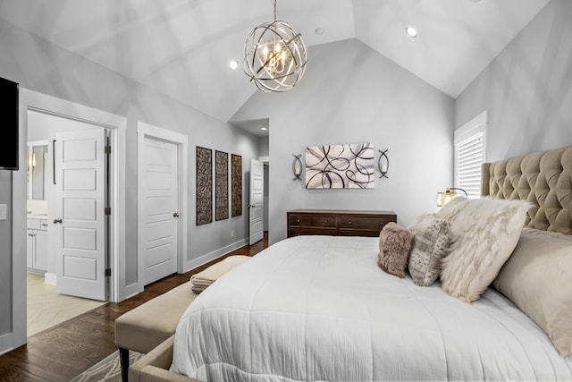 bedroom with lofted ceiling, hardwood / wood-style floors, and a chandelier