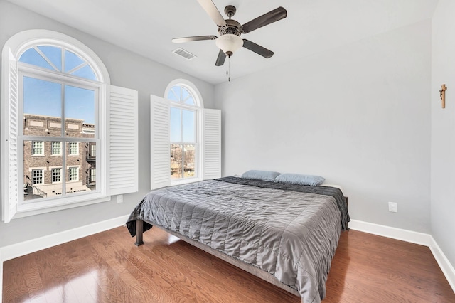 bedroom featuring wood-type flooring and ceiling fan