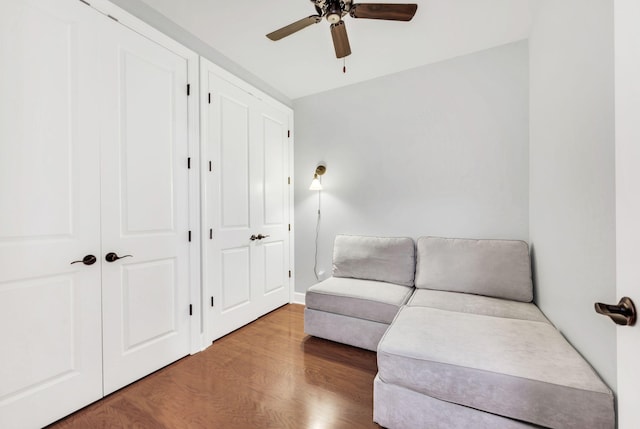 sitting room featuring hardwood / wood-style flooring and ceiling fan