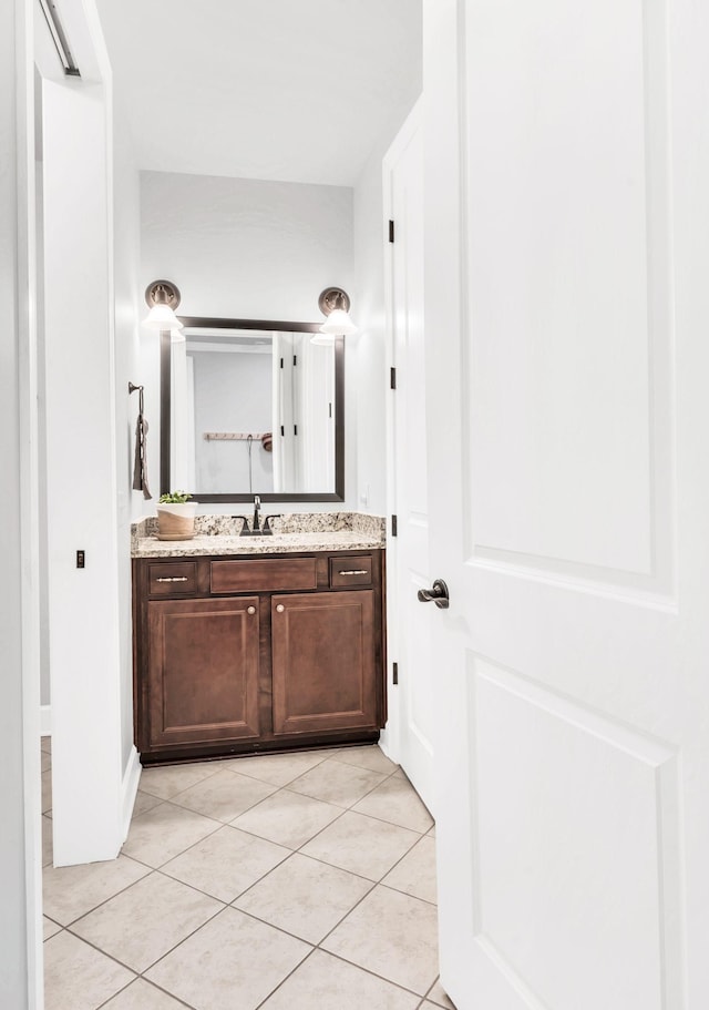 bathroom featuring tile patterned floors and vanity