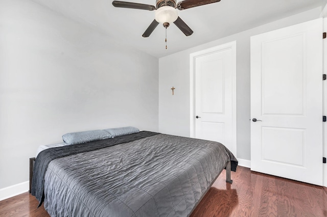 bedroom featuring dark wood-type flooring and ceiling fan