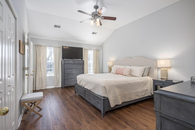 bedroom with vaulted ceiling, ceiling fan, and dark hardwood / wood-style flooring