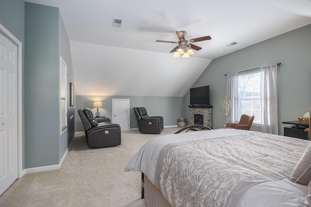 carpeted bedroom featuring vaulted ceiling and ceiling fan