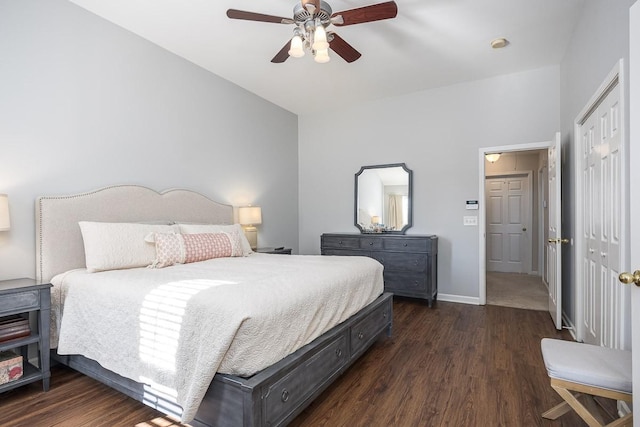 bedroom with dark hardwood / wood-style floors, ceiling fan, and a closet