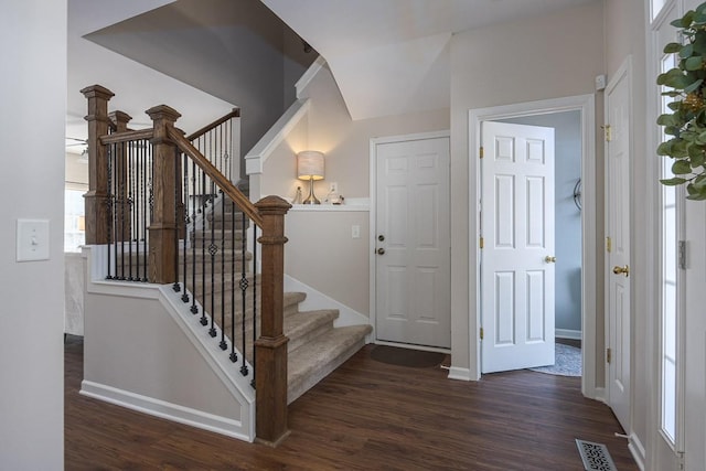 staircase with wood-type flooring