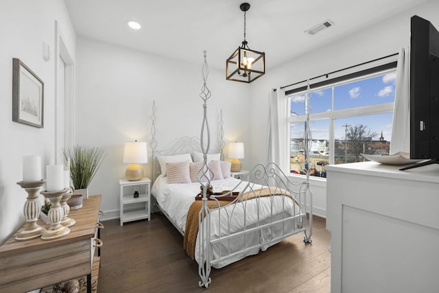 bedroom with dark wood-type flooring