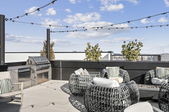 view of patio featuring a grill and an outdoor kitchen