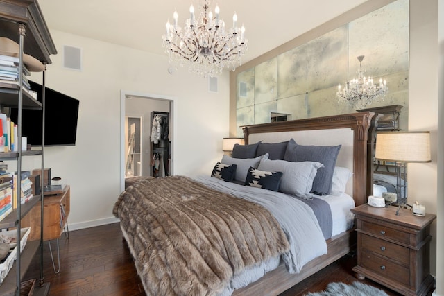 bedroom featuring dark hardwood / wood-style floors and a chandelier