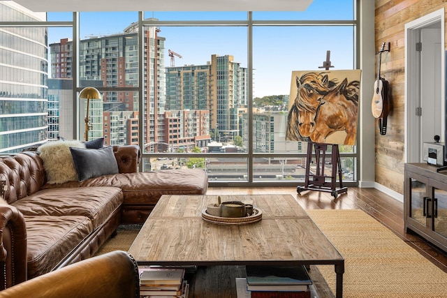 living room with expansive windows and wood-type flooring