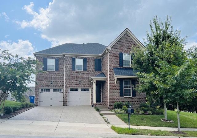 view of front facade with a garage and a front yard