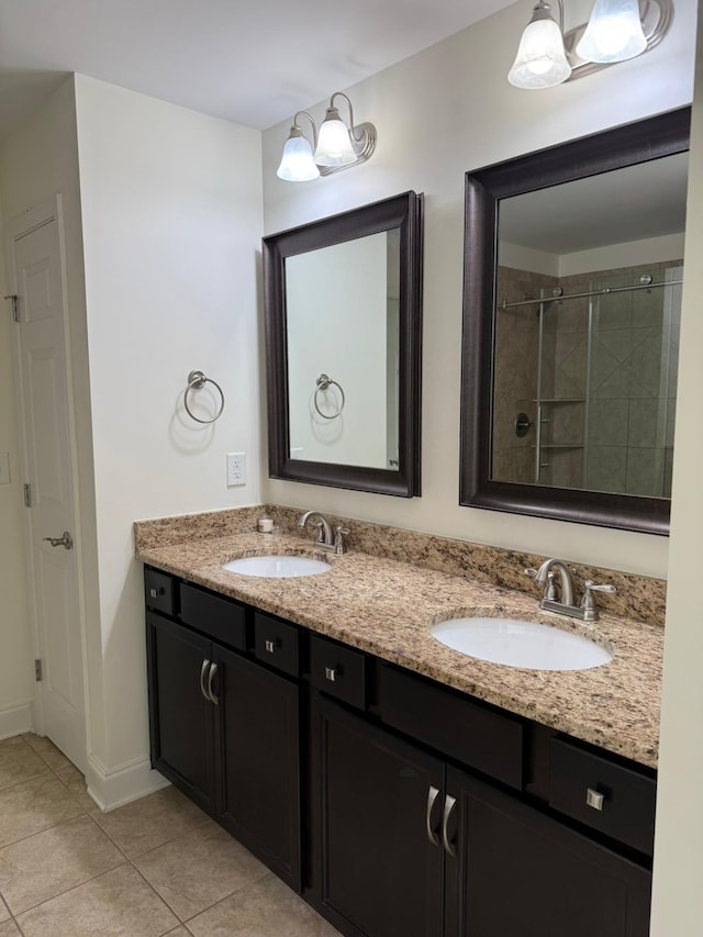 bathroom with walk in shower, tile patterned floors, and vanity