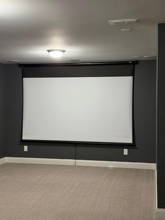 cinema room featuring carpet floors