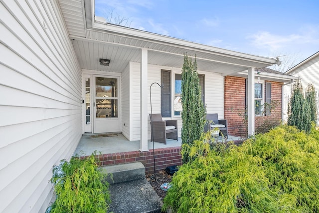 doorway to property featuring a porch