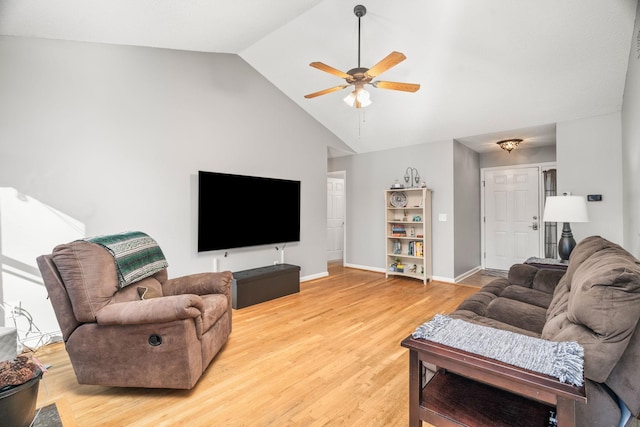 living room with vaulted ceiling, ceiling fan, and light hardwood / wood-style floors