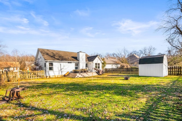 view of yard with a wooden deck and a shed