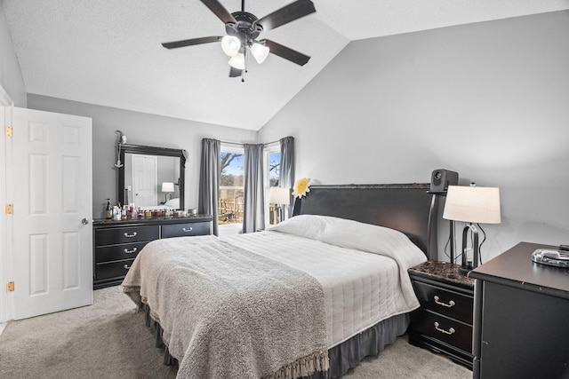 carpeted bedroom with vaulted ceiling and ceiling fan