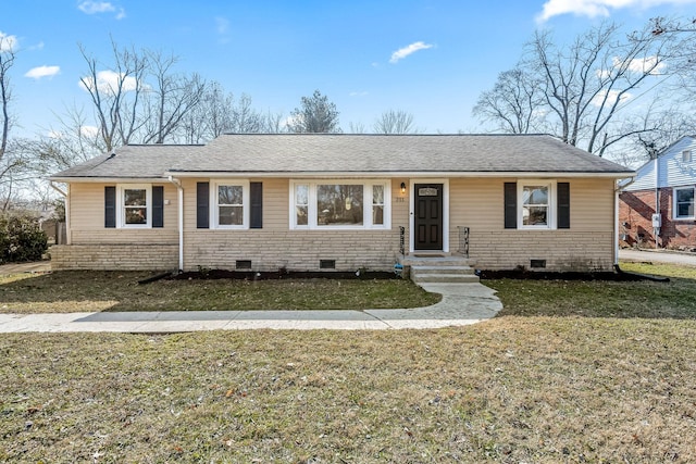 ranch-style home with a front lawn