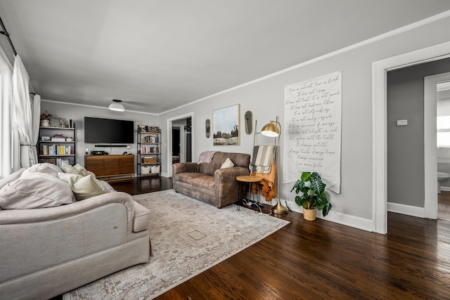 living room featuring crown molding and hardwood / wood-style flooring