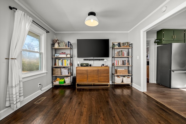 living room featuring ornamental molding and dark hardwood / wood-style floors