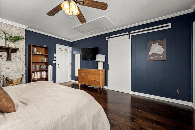 bedroom featuring crown molding, ceiling fan, dark hardwood / wood-style floors, and a barn door