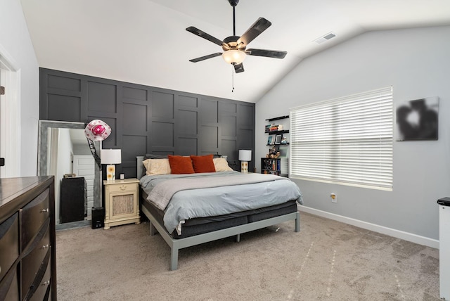 carpeted bedroom with ceiling fan and lofted ceiling