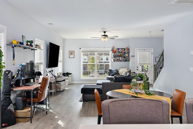 dining space featuring ceiling fan and light hardwood / wood-style floors