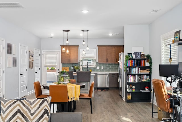 dining room featuring light hardwood / wood-style floors