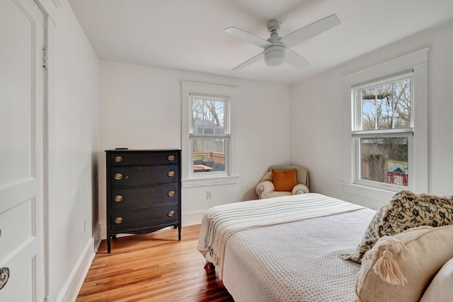 bedroom featuring light wood-type flooring and ceiling fan