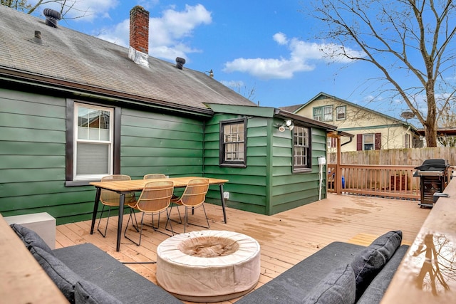 deck with outdoor lounge area and grilling area