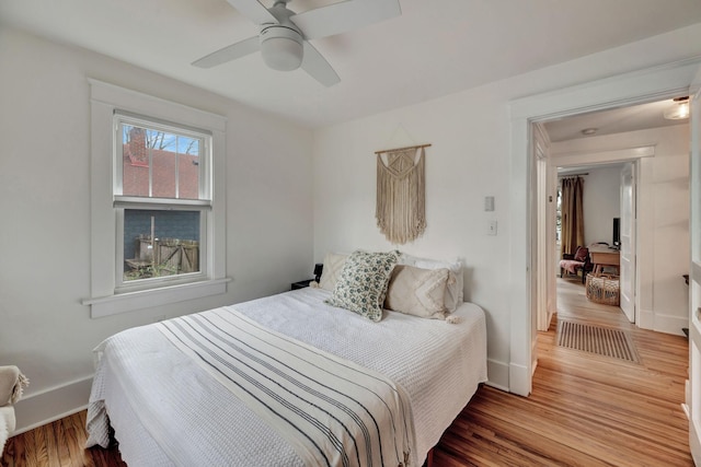 bedroom featuring ceiling fan and hardwood / wood-style floors