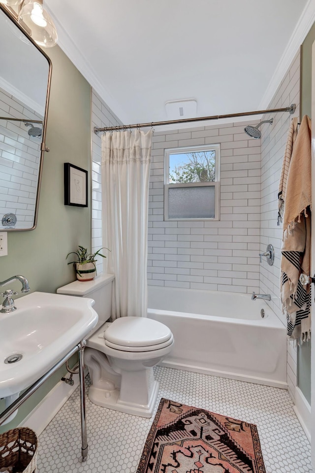 full bathroom featuring shower / tub combo, sink, ornamental molding, and toilet