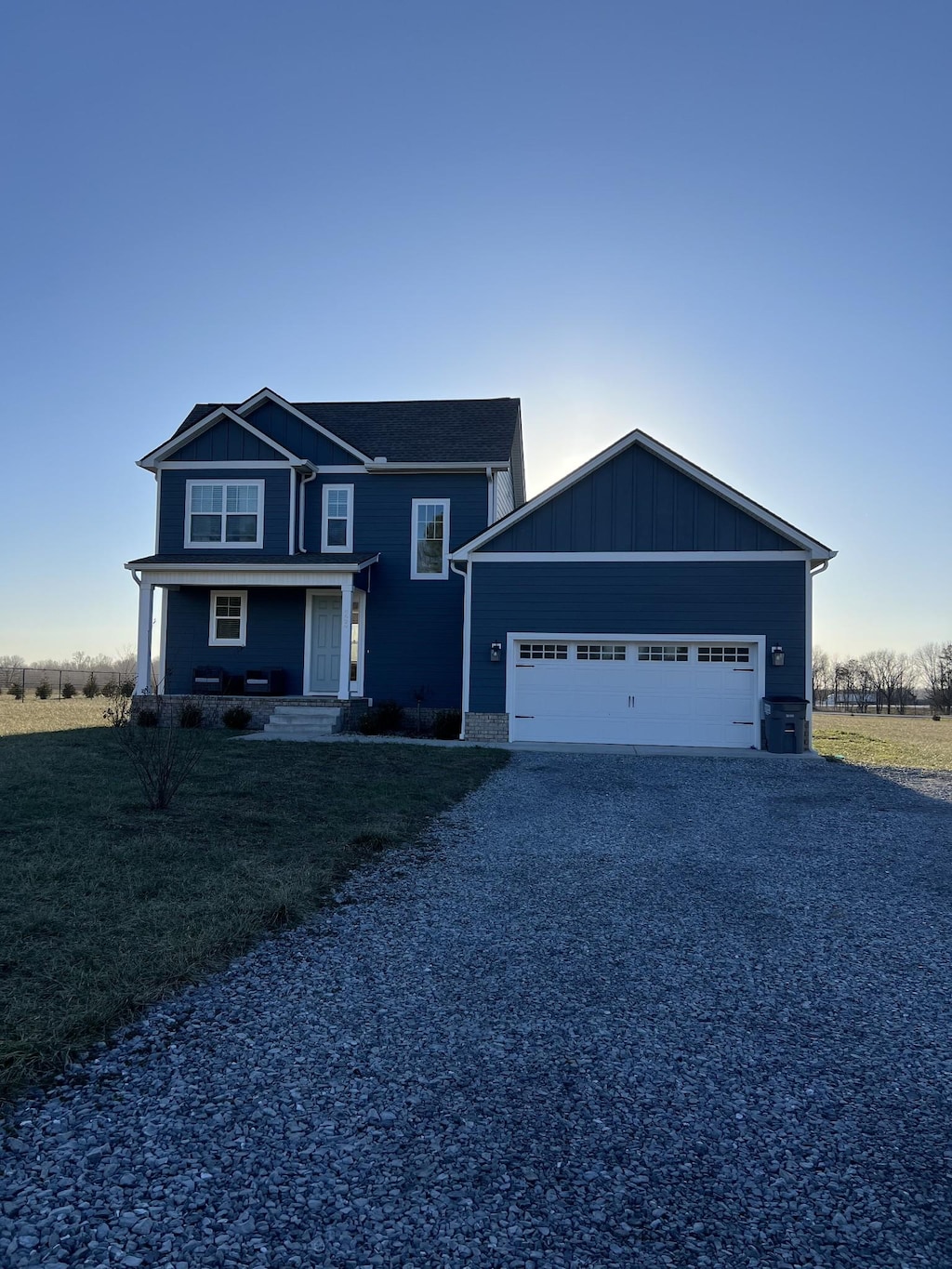 view of front of property featuring a garage and covered porch