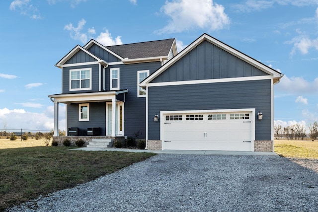 craftsman-style house featuring a porch, a garage, and a front yard