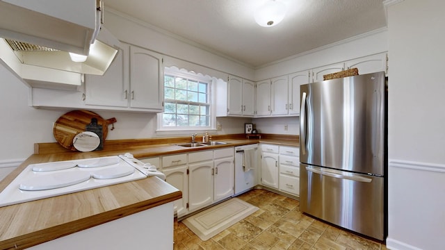 kitchen with white cabinetry, white appliances, crown molding, and sink