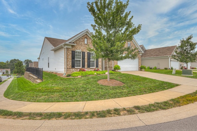 view of front of house featuring a garage and a front lawn