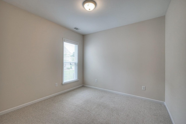 empty room featuring light colored carpet