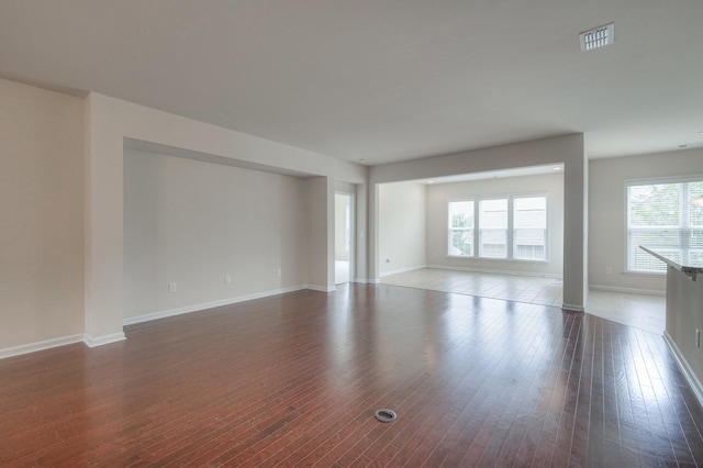 empty room featuring dark hardwood / wood-style flooring