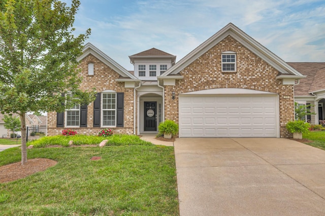 view of front of house with a garage and a front yard