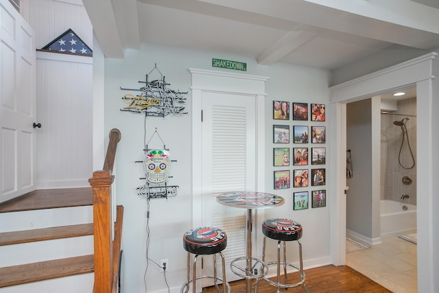 interior space featuring hardwood / wood-style flooring and beamed ceiling