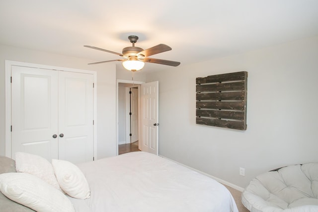 bedroom featuring ceiling fan and a closet