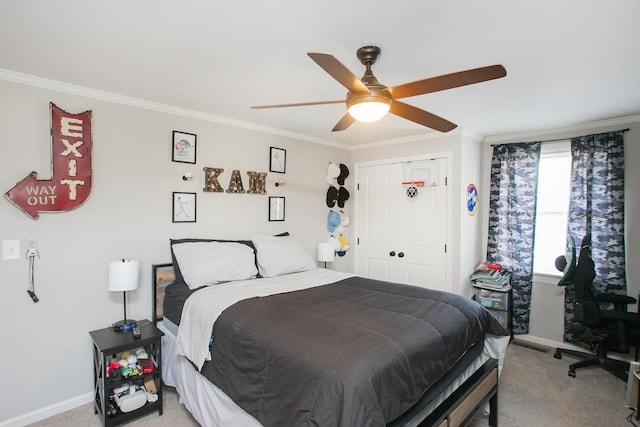 bedroom with ornamental molding, light carpet, ceiling fan, and a closet